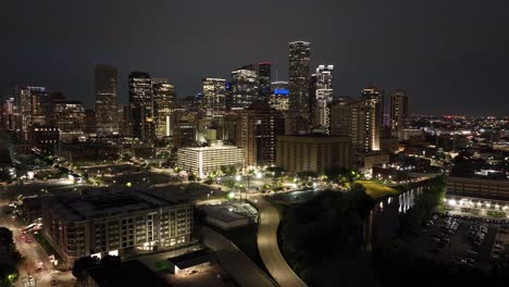 downtown houston, texas at night with drone video moving left to right