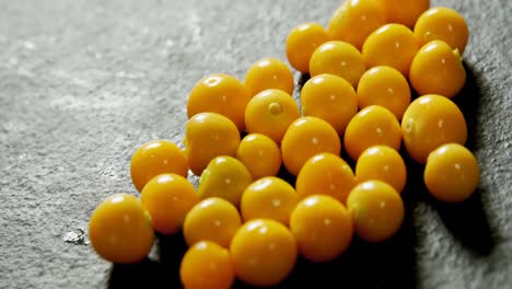 golden berries on grey background 4k 4k