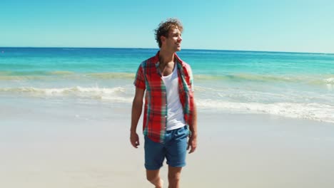 man walking on the beach