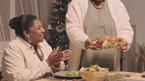 family celebrating christmas dinner together