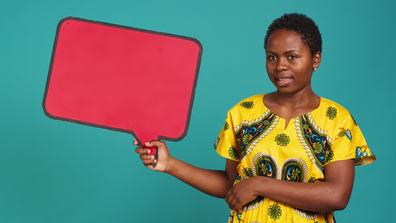 Woman in ethnic clothes holds a speech bubble carton board