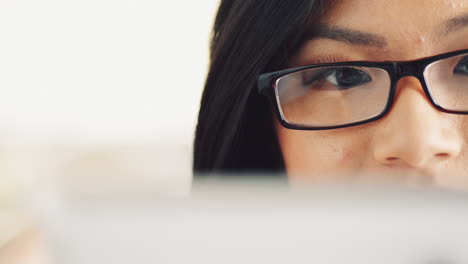 Attractive-young-woman-using-digital-tablet-computer-touchscreen-ipad