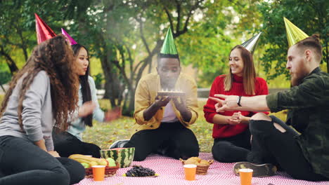 friends celebrating a birthday picnic