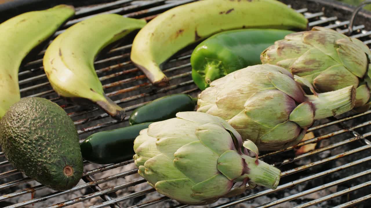 Vegan vegetarian bbq barbuque, grill Many various of green vegetables on plate close-up. Fresh artichoke, green pepper, zucchini, avocado. Cafe and restaurant food.