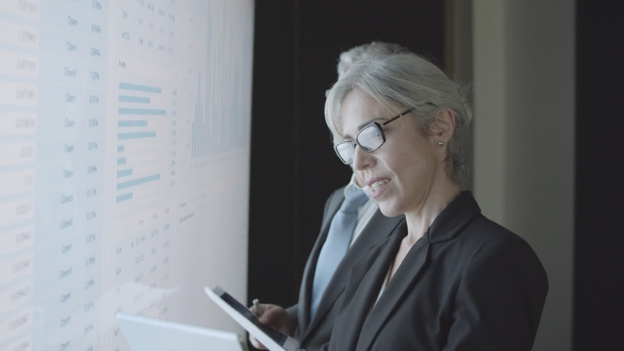 Investors with documents and tablet