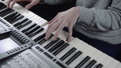 closeup of a man playing the piano