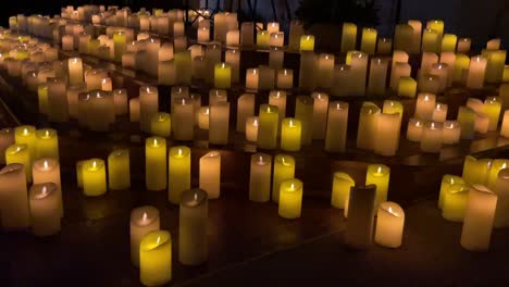 rows of flickering candles creating a warm and tranquil ambiance at the candlelight concert