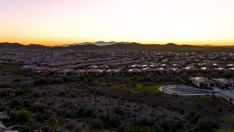 Amazing-aerial-timelapse-shot-of-suburban-area-in-Vistancia,-Arizona-going-from-day-to-night