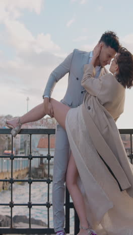 couple dancing on a bridge