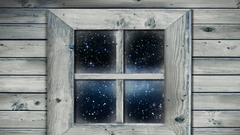 animación de la nieve cayendo vista a través de la ventana