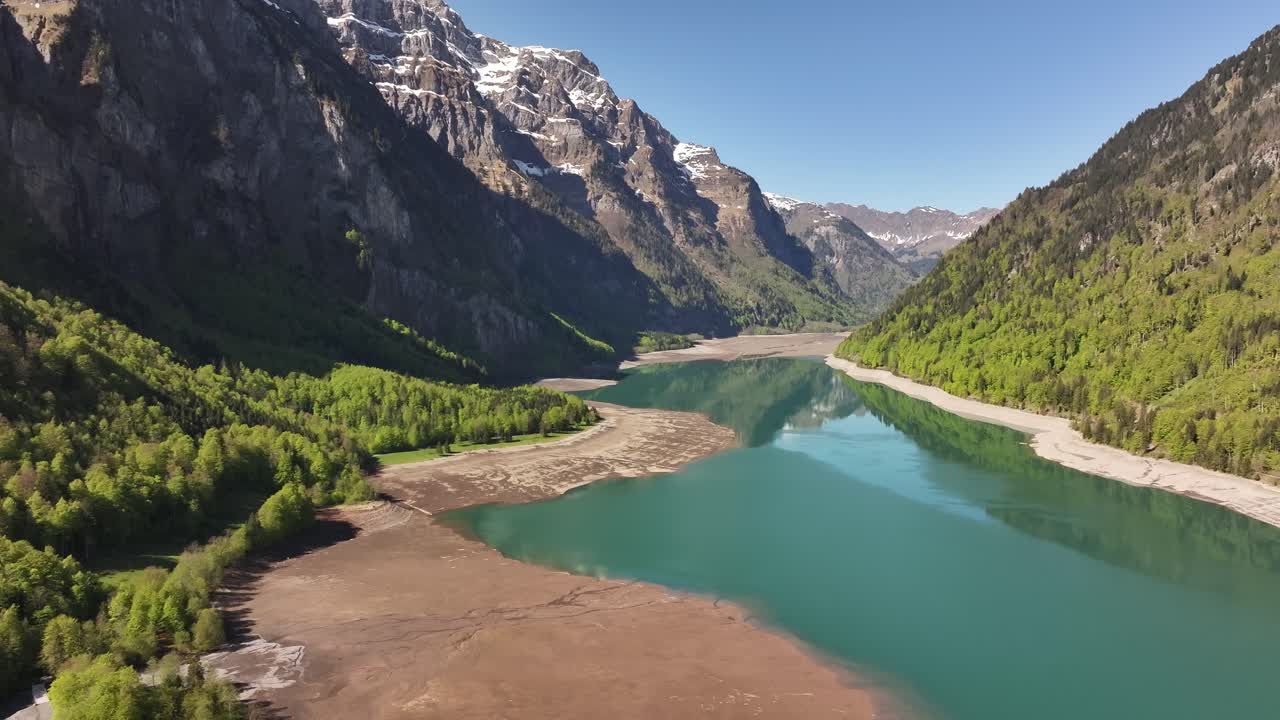 Aerial View Of Klontalersee Lake With Calm Blue Water Surrounded By Mountains In Glarus, Switzerland