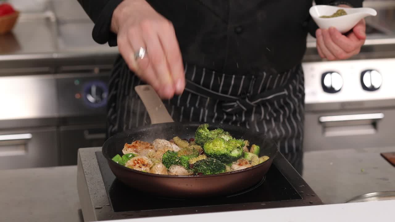 Chef Seasoning Chicken and Vegetables