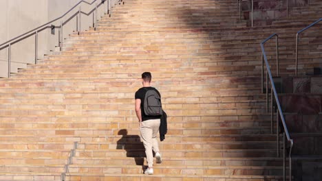 man climbing stairs in melbourne, australia