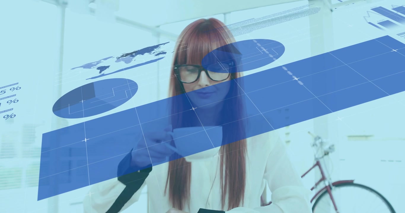 woman sipping coffee at desk in business office, showing animated pie charts and world map