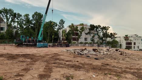 construction site with crane and demolition debris