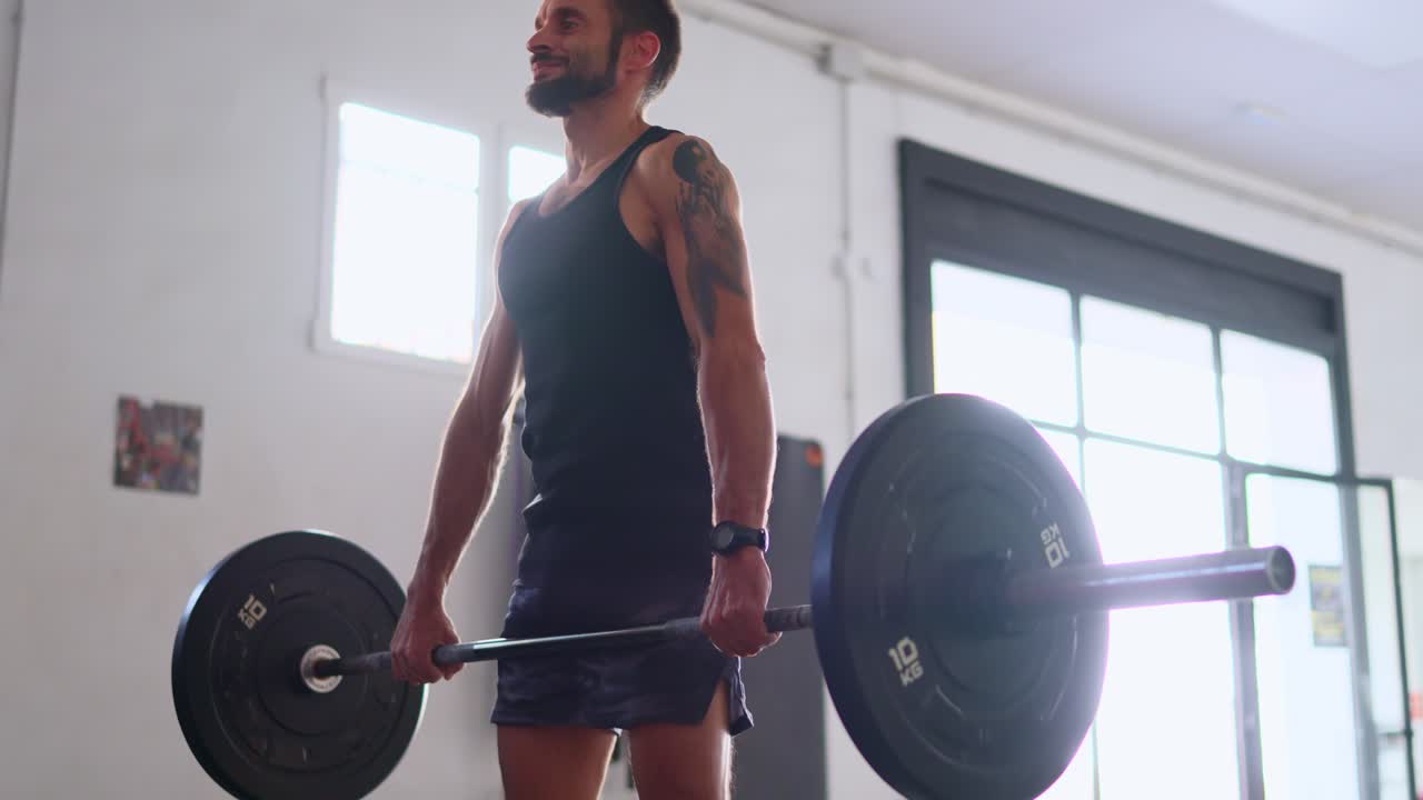 Man Performing Deadlift Exercise in a Gym