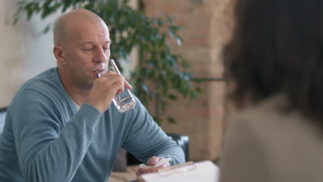 emotional man talking to therapist about his problems