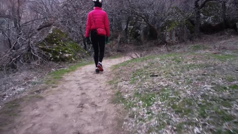 Drone-Follows-A-Tourist-Walking-In-Ihlara-Valley-In-Cappadocia,-Turkey