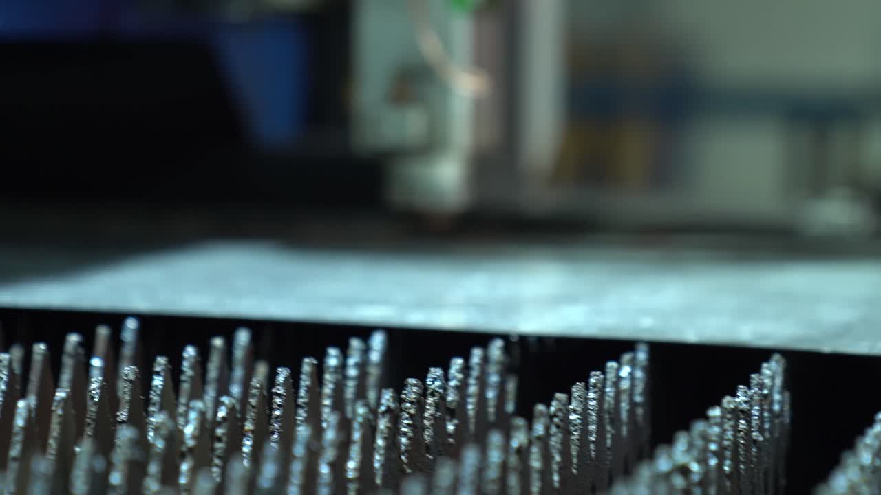 Close Up Shot Of An Automated CNC Machine Precision Cutting Steel Plate During Fabrication Process