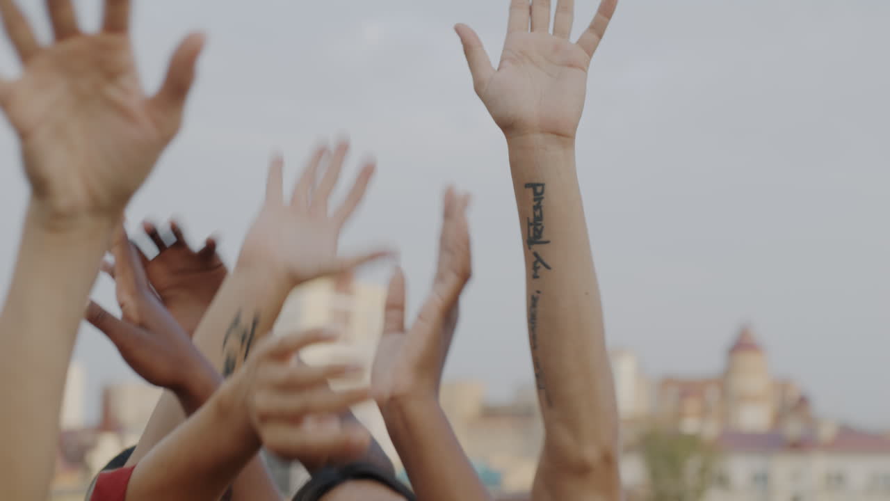 People Raising Hands in Celebration
