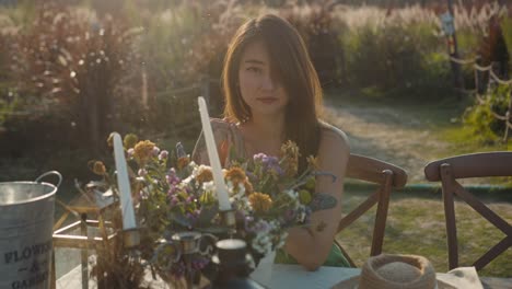 woman in a garden setting with floral decor