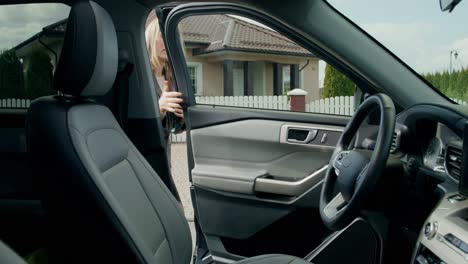 woman in a car using a phone