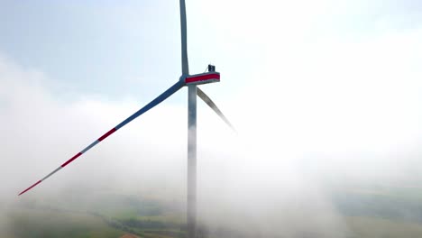 Wind-Turbine-In-Heavy-Fog-In-Weinviertel,-Austria---drone-shot