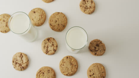 Video-of-biscuits-with-chocolate-and-milk-on-white-background