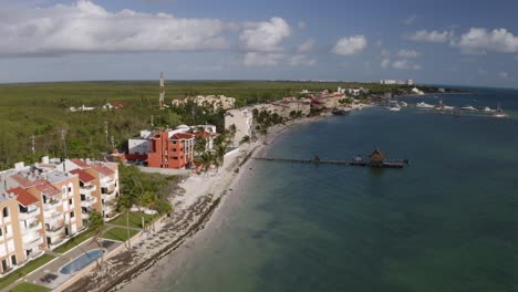 Aerial-drone-view-of-beautiful-beach-front-hotel-resort-with-swimming-pool