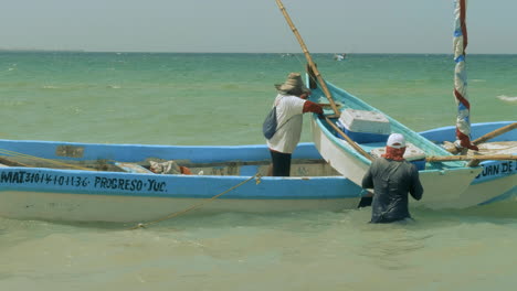 fishermen and boats at puerto progreso life in merida yucatan mexico. progreso yucatan january 7, 2019