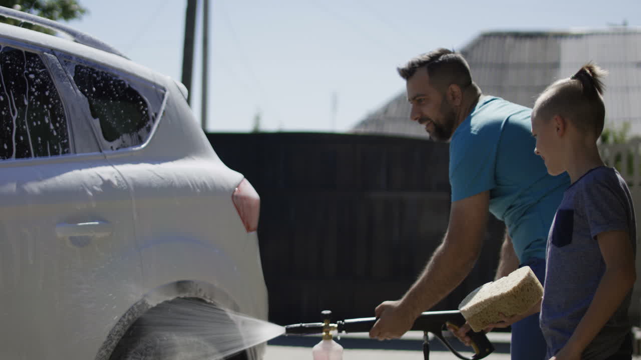 Father and Son Washing a Car