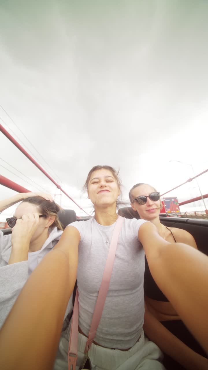 Friends on a road trip at a bridge