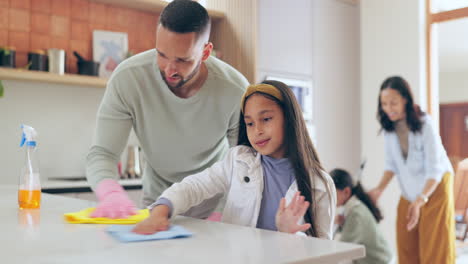 father, child and wipe kitchen table