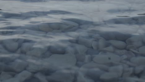 Little-waves-coming-in-and-out-pebbles-on-a-shore-in-the-calanque-france.