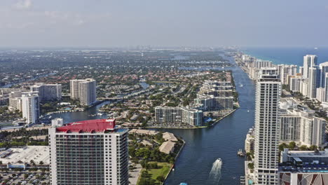 hallandale beach florida aerial v6 establishing tracking shot overlooking at hollywood lakes neighborhood with intracoastal waterways as leading line reveals beachfront condo towers - march 2021