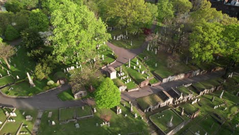 Big-garden-cemetery,-aerial-reverse-shot
