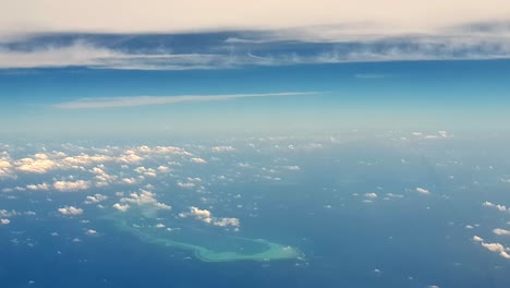 amazing aerial view of atoll of turquoise maldives archipelago and clouds