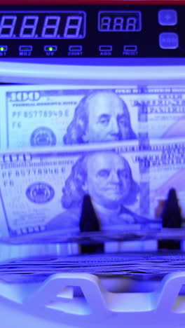 dollar counting equipment in bank. money banking counter. money and economics concept. cropped view vertical video