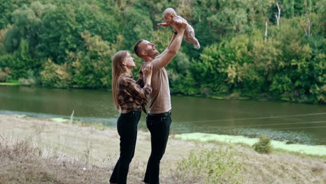 happy family with baby outdoors