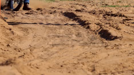 motorcycle traversing rough dirt trail