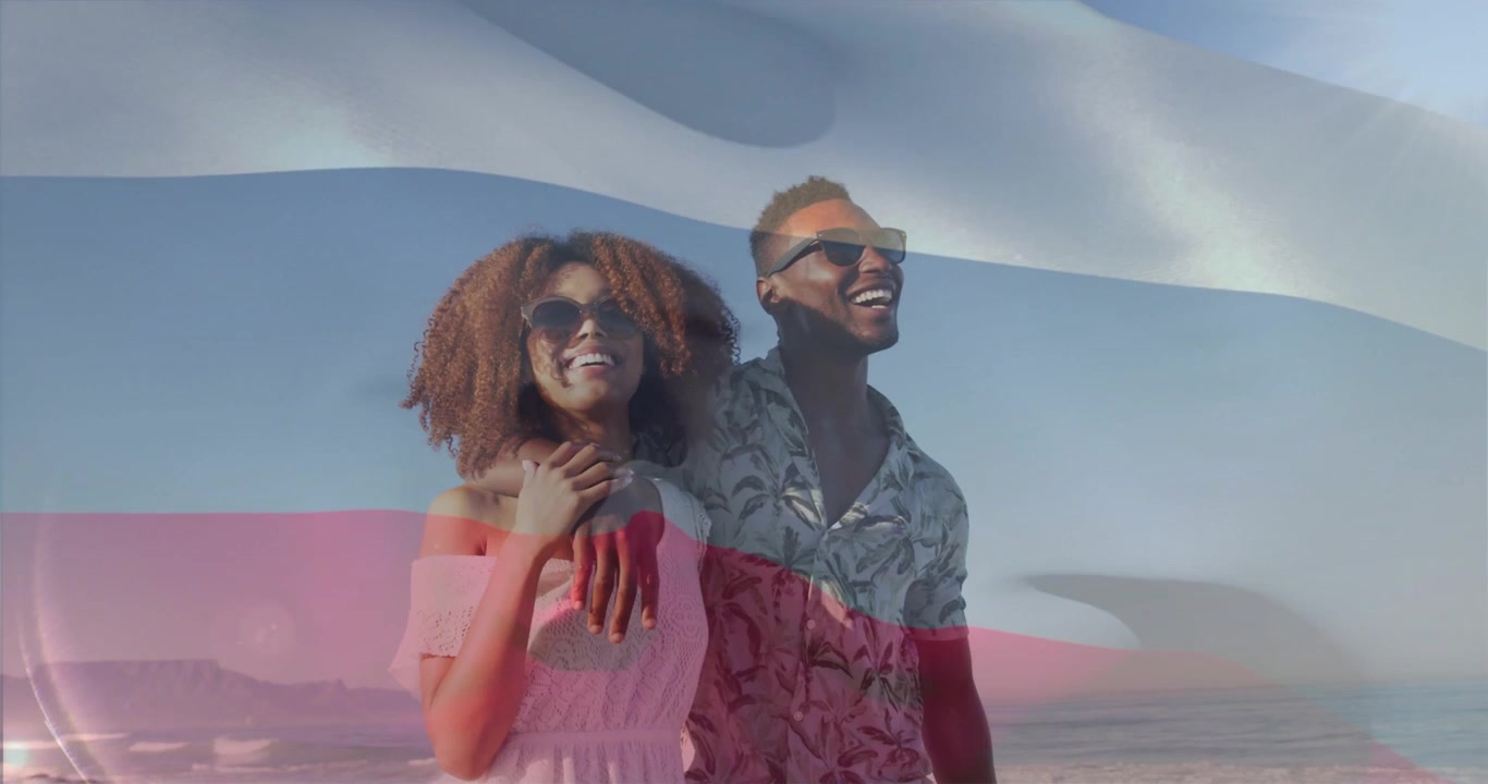 Clip starting couple in shades posing on coast as flag overlay rippling covering duo aiding travel