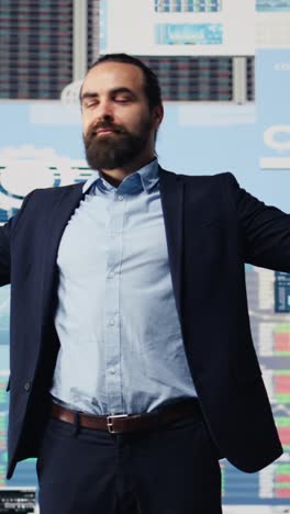 vertical video fearless businessman celebrates success and achievement for high end career