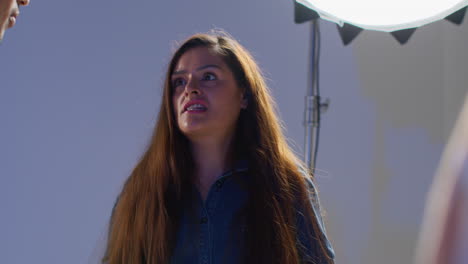 close up of male and female actors shooting movie or video scene in studio on set 1