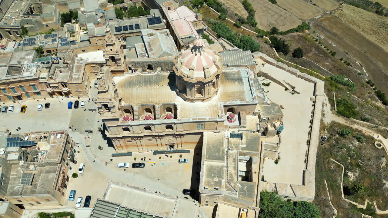 Aerial drone view of the walled city of Valletta, Malta, surrounded by the Mediterranean sea in daylight