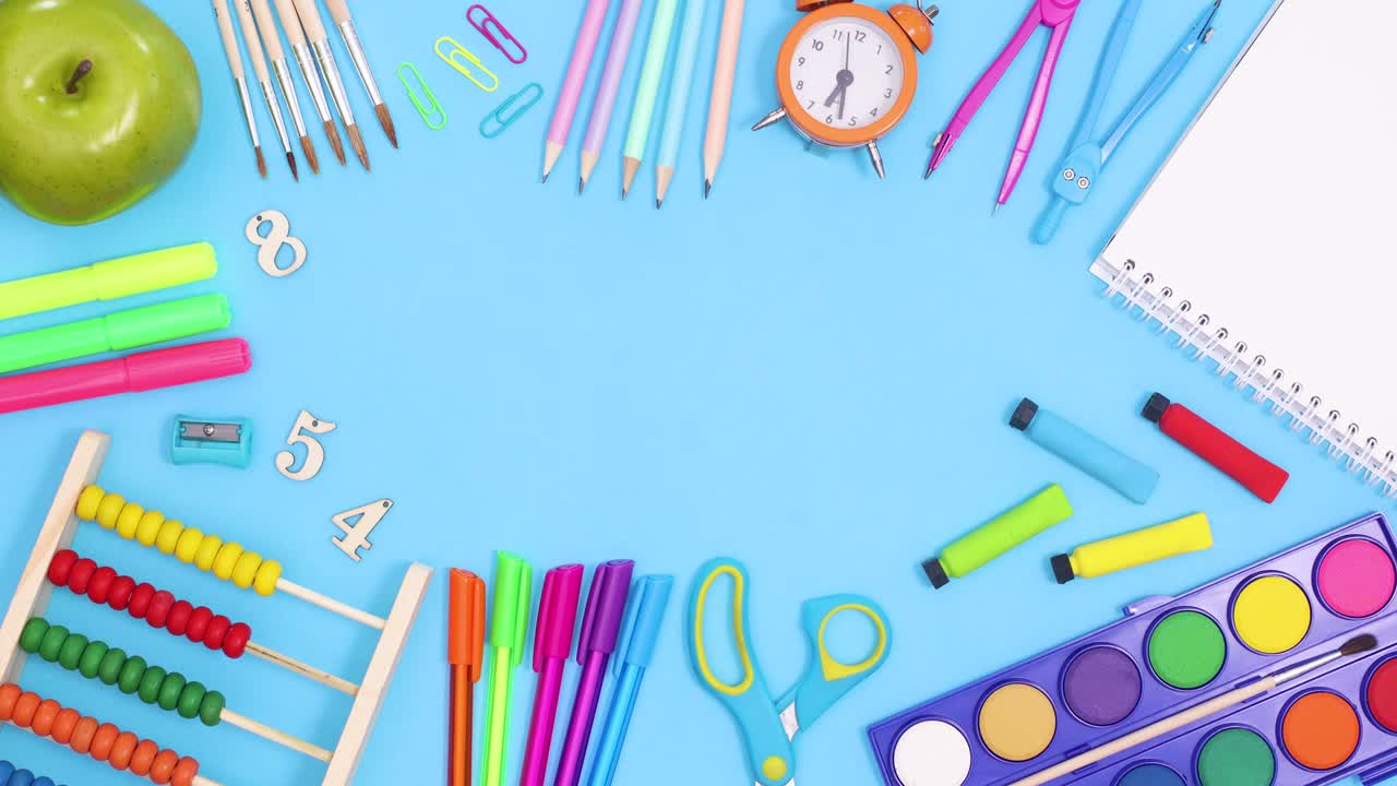 School frame made of school tools on blue theme. Stop motion