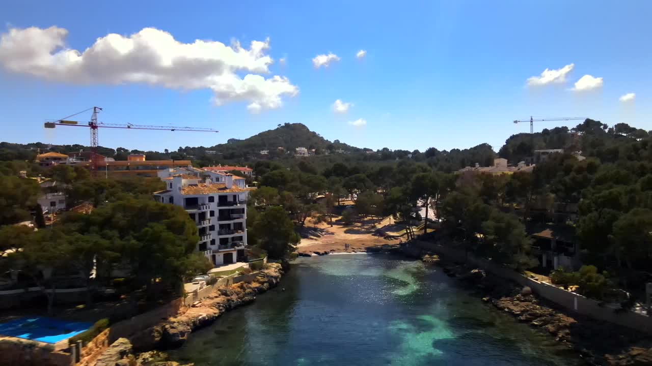 Experience the breathtaking beauty of Santa Ponsa in Mallorca. Enjoy the serene coastal landscape with clear waters, lush greenery, and sunny weather, perfect for relaxing moments.