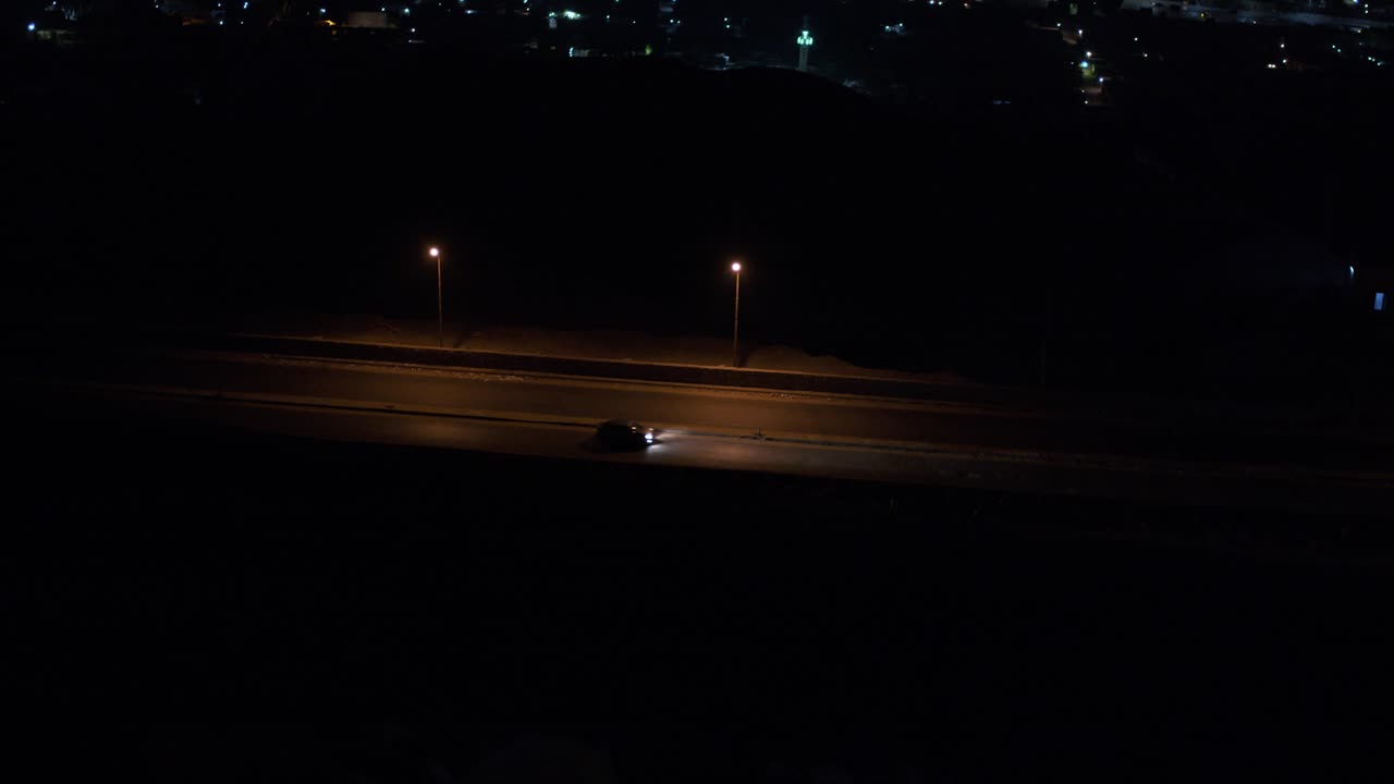 lowlight road at midnight from mountain