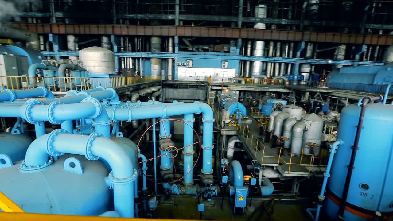 Turbine of thermal power plant. Powerful turbine in the steam turbine hall of power plant