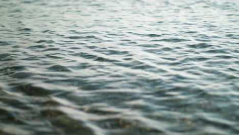 Shallow-waves-rippling-on-beach,-tidal-water-motion-background