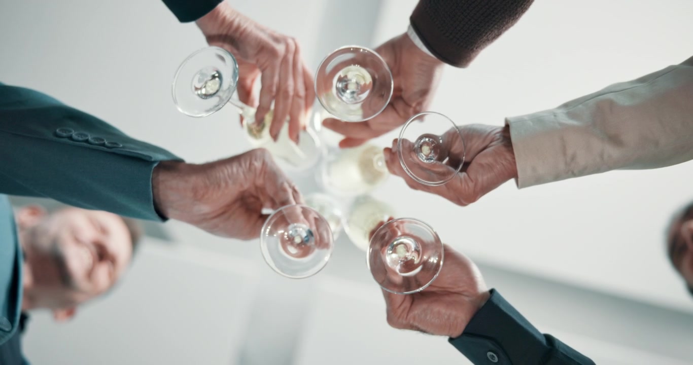 Business Colleagues Toasting with Champagne Glasses in Office